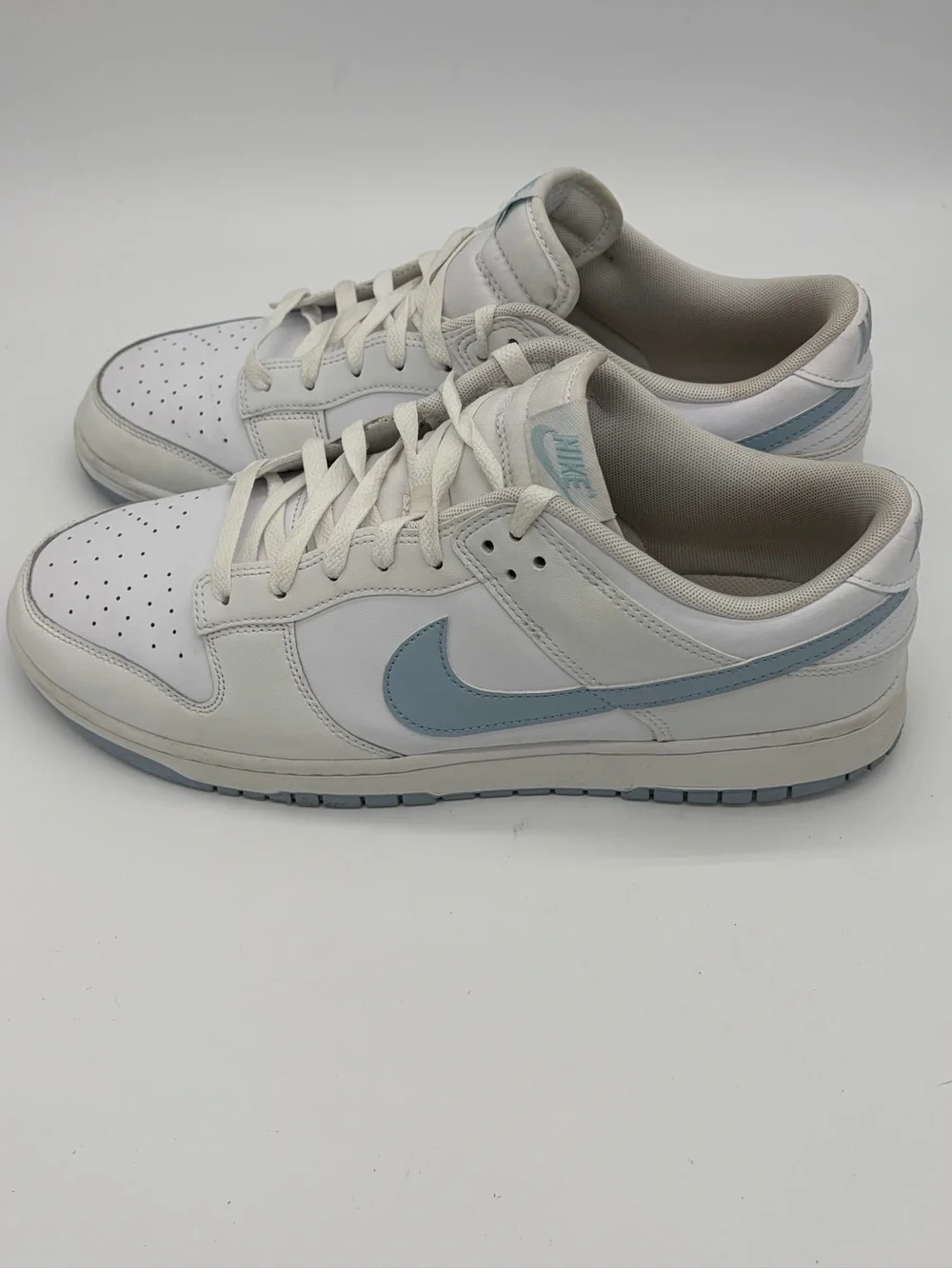 Nike Dunks Men’s Low-Top Sneakers in White with Light Blue Swoosh